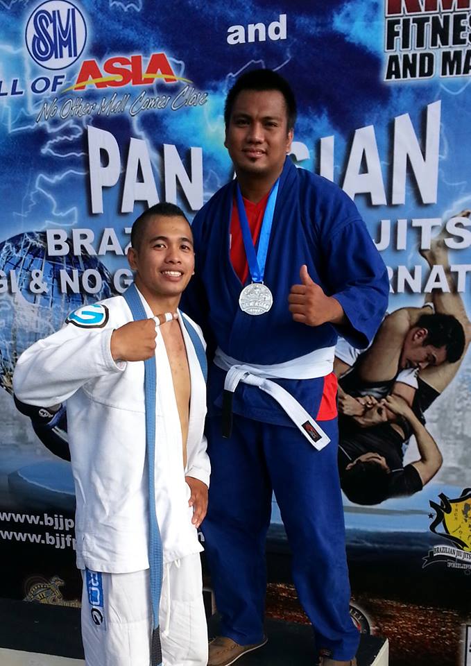 MMA Lucena coach Marc Louie Aldovino and member Art Mendiola posed together after the latter's win at the recently concluded Pan-Asian Brazilian Jiu Jitsu Tournament held last May. Photo courtesy of MMA Lucena
