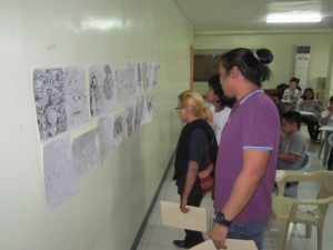 Photo showing the judges of the contest evaluating the submitted entries